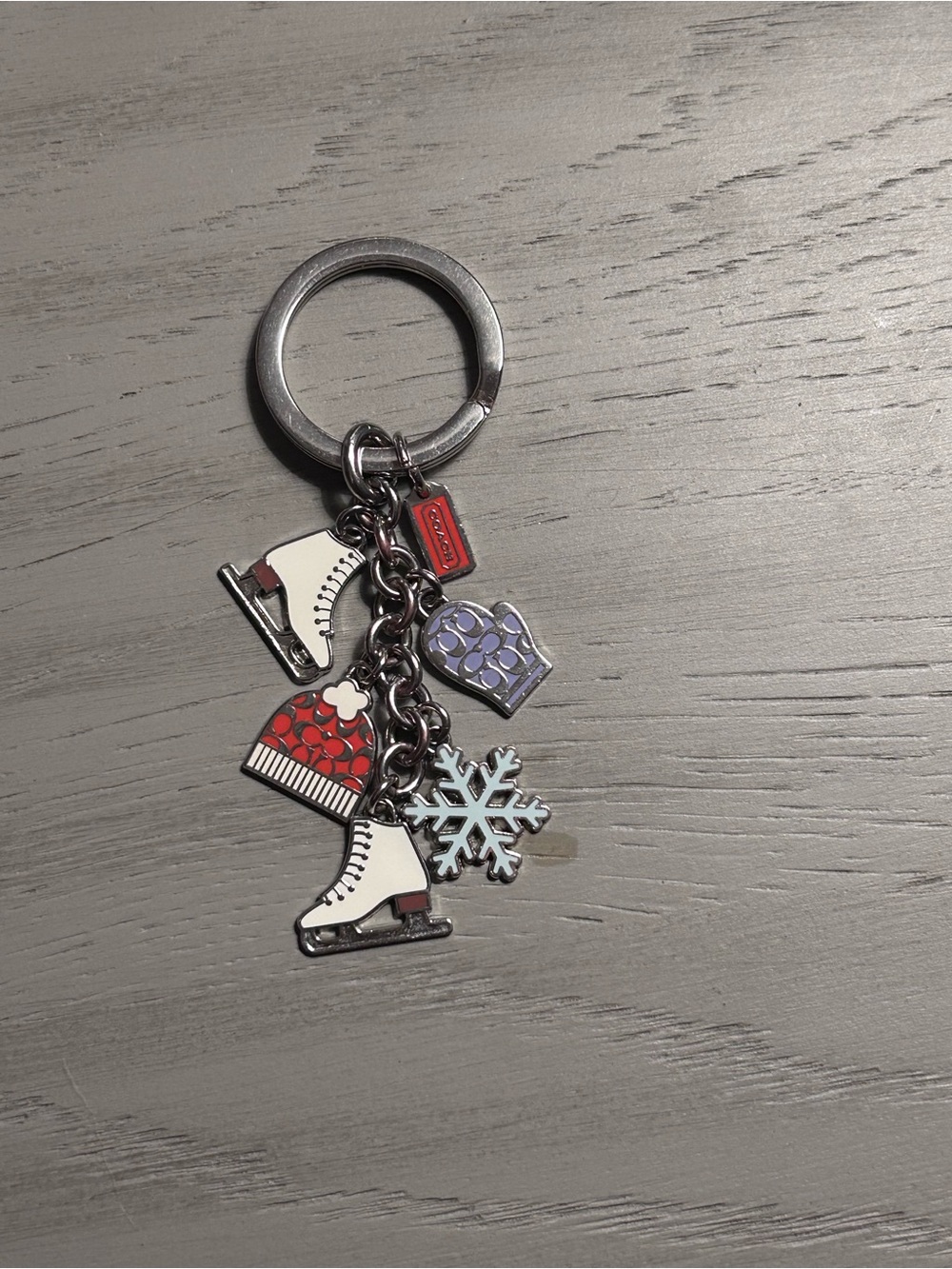 Coach winter themed charm keychain